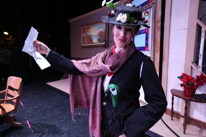 Mary Poppins, portrayed by Amy Fredrick, reads the advertisement Jane and Michael Banks wrote for a new nanny during the rehearsal of the Family Community Theatre's production of Mary Poppins at Memorial Hall.