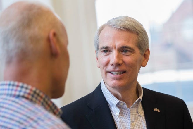 Sen. Rob Portman, R-Ohio, arrives at the Queen City Mobile Summit at Union Hall, Wednesday, Feb. 17, 2016, in Cincinnati. Ohio's Republican senator is urging quick federal action to investigate allegations raised about management and care at the Cincinnati Veterans hospital in a news report citing whistleblowers and documents.