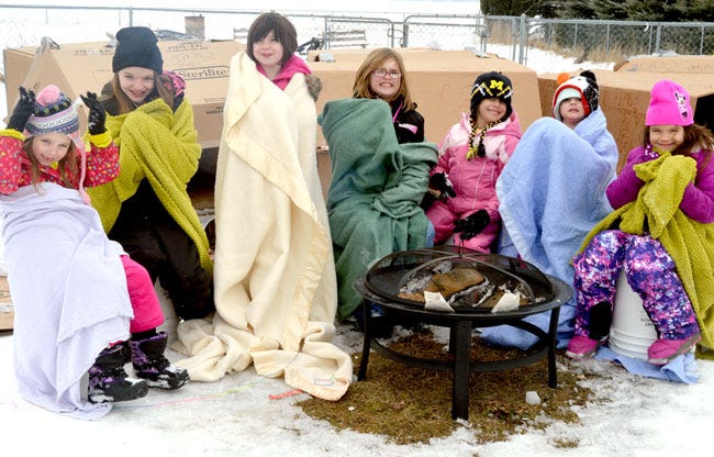 Members of White Pigeon Girl Scouts troop 90820 spent six hours Monday outdoors to help raise awareness about homelessness.