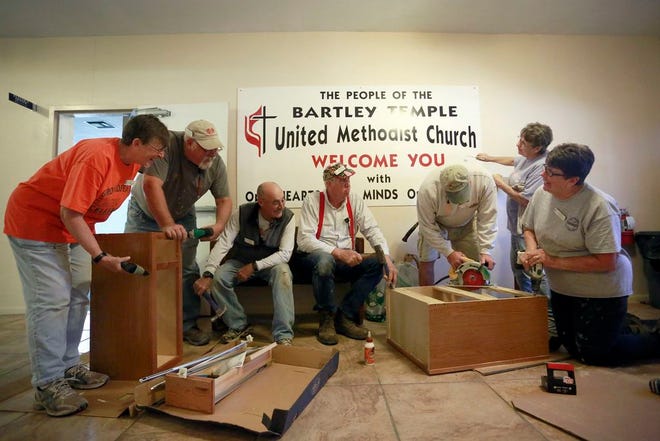 NOMADS, from left, Vicki Kuebler, Gene Coulter, Jim Kuebler, Norman "Stormy" Maske, Bill Smoot, Beverly Smoot and Mary Ann Coulter, work as a team at Bartley Temple United Methodist Church painting, making repairs and improving the church.