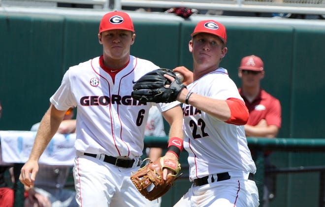 Georgia pitcher Robert Tyler (22) throws a runner out at first base during Georgia's Senior Day game against Arkansas on Saturday, May 16, 2015, in Athens, Ga.
(UGA sports communications)
