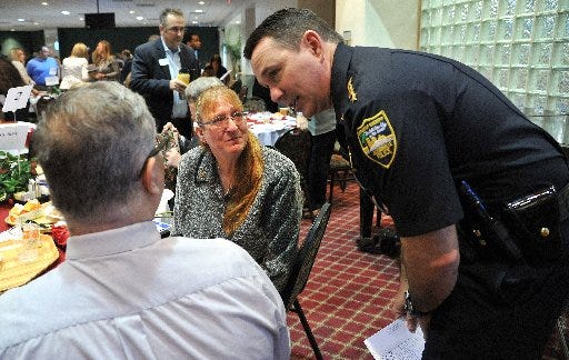Sheriff Mike Williams talks with Steven and Raelyn Rowe, the parents of Daniel Rowe, who was killed while working at the Blind Rabbit this past summer. They gathered Thursday for the 14th annual Justice Coalition Together We Can Campaign breakfast at First Baptist Church.