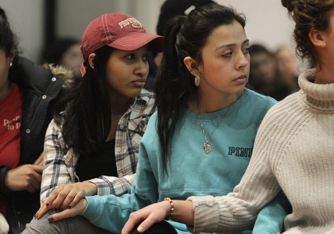 Providence College students Leslie Hernandez, left, and Alexandria De La Zerda were among those who turned out for the discussion Thursday night. The Providence Journal / Kris Craig