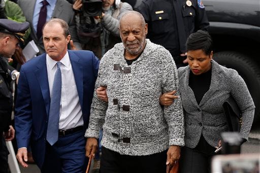 FILE - In this Dec. 30, 2015 file photo Bill Cosby, center, accompanied by his attorneys Brian McMonagle, left, and Monique Pressley, arrives at court to face a felony charge of aggravated indecent assault, in Elkins Park, Pa. A Los Angeles judge on Tuesday, Feb. 9, 2016, dismissed Cosby's former attorney Martin Singer from a defamation lawsuit filed by model Janice Dickinson over denials of her allegations the comedian drugged and raped her in Lake Tahoe, Calif., in 1982. (AP Photo/Matt Rourke, File)