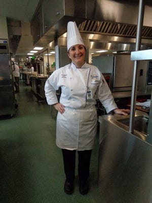 Chef Debbie helps out in the kitchen at the Advanced Technology Center at Gulf Coast State College.