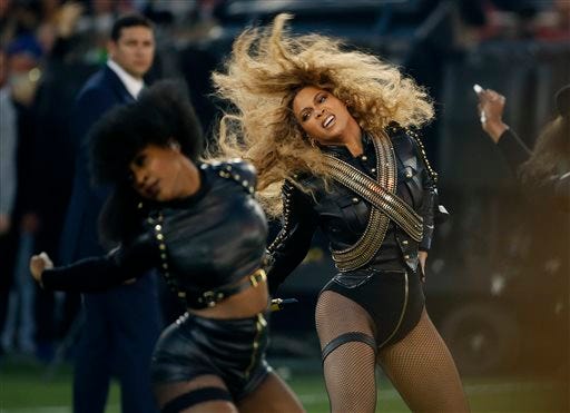 In this Sunday, Feb. 7, 2016 photo, Beyonce performs during halftime of the NFL Super Bowl 50 football game in Santa Clara, Calif. Beyonce is working overtime this weekend: After releasing a new song Saturday and performing at the Super Bowl on Sunday, she's announced a new stadium tour. The Grammy-winning singer announced her 2016 Formation World Tour in a commercial after she performed at the halftime show with Bruno Mars and Coldplay.