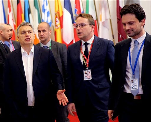 Hungarian Prime Minister Viktor Orban, third left, leaves the building during an EU summit in Brussels on Friday, Feb. 19, 2016. British Prime Minister David Cameron faces tough new talks with European partners after through-the-night meetings failed to make much progress on his demands for a less intrusive European Union.
