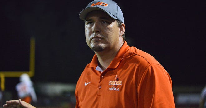 Mount Dora head coach Donnie Burchfield watches the Hurricanes during a game against South Sumter on Oct. 30, 2015 at Raider Field in Bushnell. Burchfield has resigned at Hurricanes coach after one season.