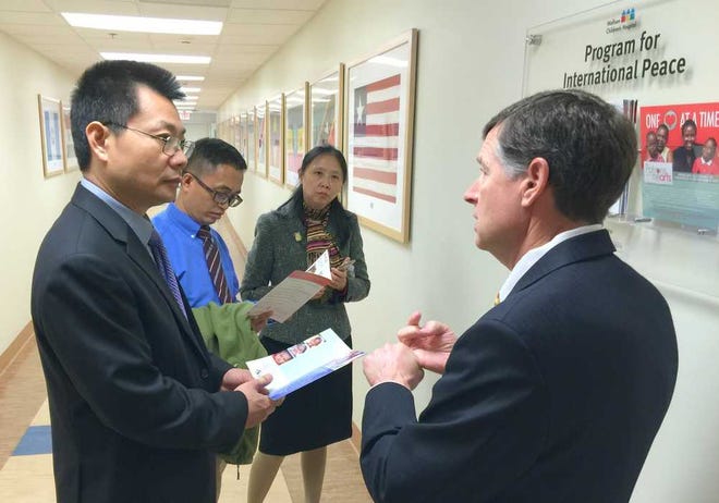 Provided by Carol Chaffin Baptist Health Michael Aubin (right) talks to Mu De-Zhi, president of West China Second University Hospital, during a tour Friday.
