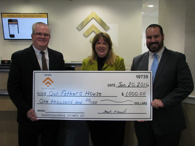 Presenting the check, from left: Mark R. O’Connell, president and CEO of Avidia Bank; Judith Pasierb, licensed clinical social worker and executive director of Our Father’s House; and Todd Wood, Leominster branch manager of Avidia Bank. Courtesy Photo
