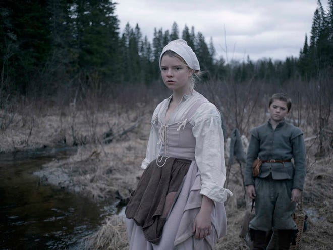 This photo provided by courtesy of A24 shows Anya Taylor-Joy, left, as Thomasin, and Harvey Scrimshaw as Caleb in a scene from the film, "The Witch." (Rafy/A24 via AP)
