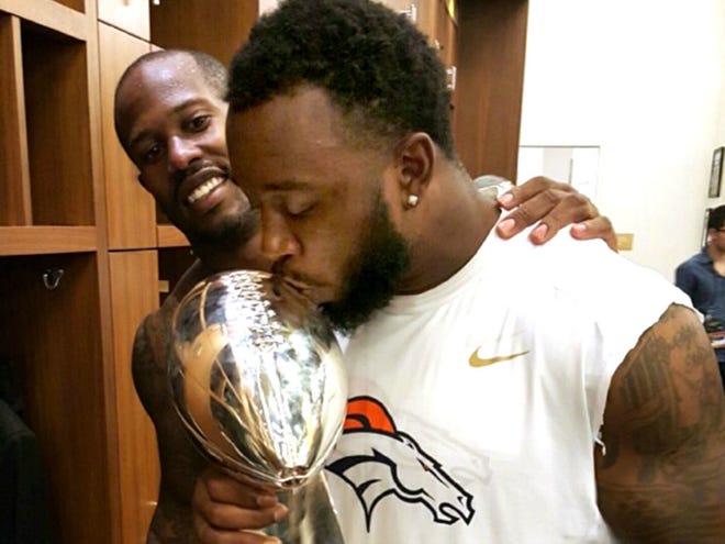 Former Dunnellon High and UF standout Lerentee McCray kisses the Lombardi Trophy after Denver won the Super Bowl on Feb. 7 in Santa Clara, Calif. Super Bowl MVP Von Miller stands next to McCray in the locker room.