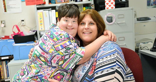 Teacher of the Year candidate Andrea Vineyard and student Addie Relyea pose for a portrait in her classroom at Tavares High School on Tuesday. Vineyard teaches ESE students at the high school.