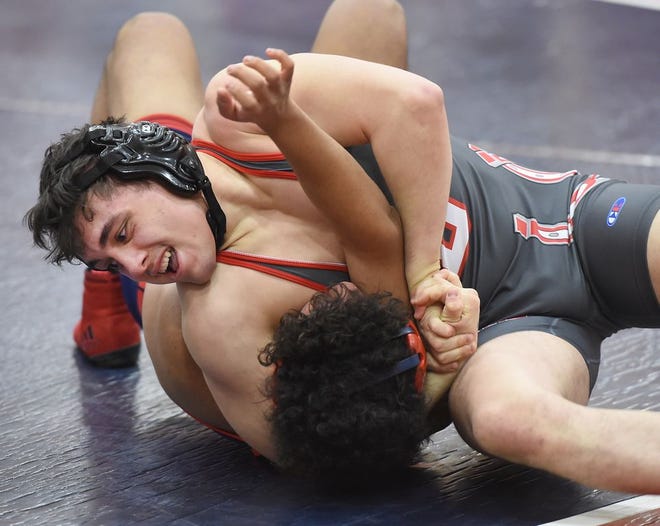 Bedford's Blake Montrie was one of nine wrestlers from around the Monroe County Region to win Regional titles Saturday. A total of 42 local wrestlers advanced to the state tournament. (Monroe News photo by TOM HAWLEY)