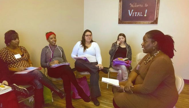 Sherveriria Harris (right), administrative coordinator of VITAL, an infant mortality-reduction pilot program, meets with a group of expectant moms in Canton. VITAL is sponsored by Pregnancy Choices, the former Pregnancy Support Center of Stark County. Ohio has one of the highest infant-mortality rates in the nation.