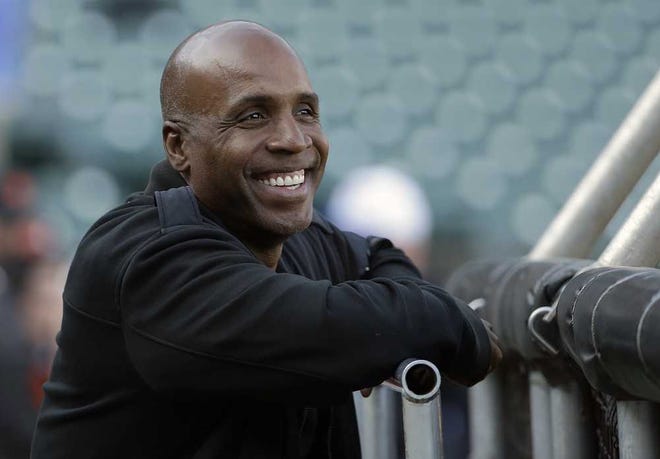 Barry Bonds smiles before a game between the San Francisco Giants and the Chicago Cubs on Aug 25 in San Francisco. Bonds is back in the major leagues as hitting coach for the Miami Marlins. (AP Photo/Jeff Chiu)