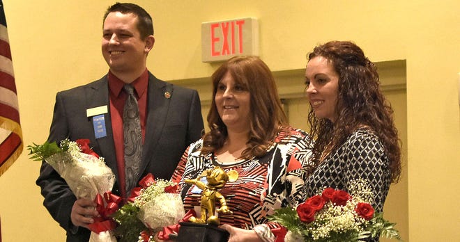 Andrea Vineyard, center, poses for pictures after being named Lake County's Teacher of the Year in Mount Dora on Saturday. Also shown are finalists Eustis High School teacher Michael Geoffrion and Lake Minneola High School teacher Kristen Pautienus.