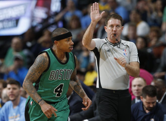 Celtics guard Isaiah Thomas reacts after making a 3-point shot during Boston's 121-101 win over the Nuggets on Sunday.
