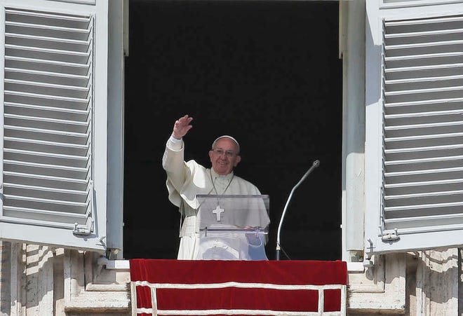 Pope Francis waves to faithful gathered in St. Peter's Square on the occasion of the Angelus noon prayer at the Vatican, Sunday, Feb. 21, 2016. Francis told tourists and pilgrims in St. Peter's Square Sunday that he is proposing Catholic leaders should "make a courageous and exemplary gesture" and ensure that no convicted inmate is executed during the church's Holy Year of Mercy, which runs through Nov. 20. (AP Photo/Alessandra Tarantino)