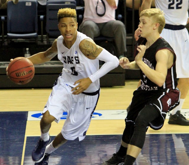 Jamie Mitchell • Times Record UAFS' Alex Cooper drives along the baseline past the Oklahoma Christian defender, Saturday, Feb 20, 2016, during first half play at the Stubblefield Center. 
 Jamie Mitchell • Times Record UAFS' Seth Youngblood shoots a three, Saturday, Feb 20, 2016, during first half play against Oklahoma City Christian at the Stubblefield Center. 
 Jamie Mitchell • Times Record Oklahoma City Christian's Jordan Rutherford grabs UAFS' DaVaunta Thomas to stop a fast break, Saturday, Feb 20, 2016, during first half play at the Stubblefield Center. 
 Jamie Mitchell • Times Record Oklahoma City Christian's Jordan Rutherford grabs UAFS' DaVaunta Thomas to stop a fast break, Saturday, Feb 20, 2016, during first half play at the Stubblefield Center.