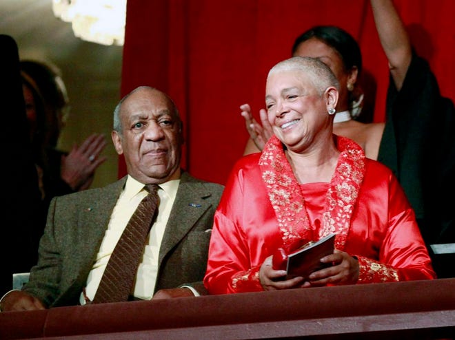 FILE - This Oct. 26, 2009 file photo, comedian Bill Cosby, left, and his wife Camille appear at the John F. Kennedy Center for Performing Arts before Bill Cosby received the Mark Twain Prize for American Humor in Washington. A judge has denied a request by lawyers for Bill Cosby's wife to postpone her deposition in a defamation lawsuit brought by seven women who claim the comedian sexually assaulted them. The judge ruled late Sunday, Feb. 20, 2016, that the deposition, scheduled for Monday, can proceed. (AP Photo/Jacquelyn Martin, File)