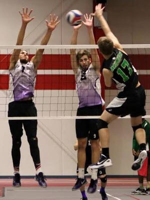 Lincoln College Sophomores Alex Robles, of Plainfield, and Adam Krzos, of Lockport, go up for a block during the MWPVC Crossover Tournament held in Romeoville over the weekend. Photo submitted by Mark Tippett