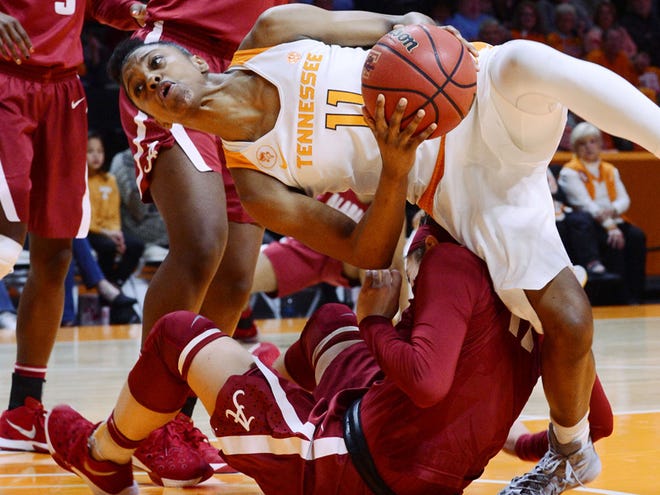 Tennessee guard Diamond DeShields falls on top of Alabama guard Hannah Cook during the second quarter of a college basketball game in Alcoa, Tenn., Sunday, Jan. 31, 2016.