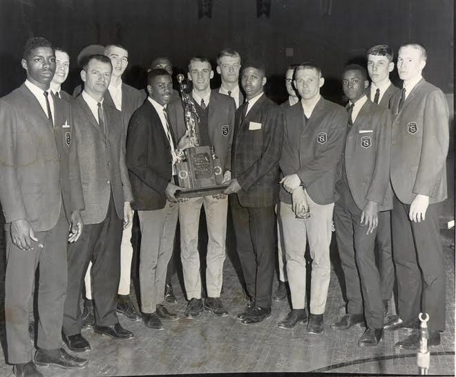 The members of the 1966 Galesburg High School boys basketball team holds the second place trophy they won at the Illinois High School Association state tournament. The 50th anniversary of that season will be honored Friday at the Silver Streaks game with Rock Island. REGISTER-MAIL FILE PHOTO