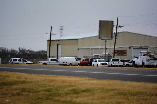 Investigators search Crossfire Manufacturing on Tuesday, Feb. 23, 2016.