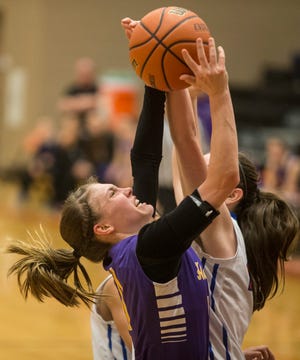 Hononegah's Ellie Welsh (11) goes up for a shot against Dundee-Crown's Maddie Trip (45) on Tuesday, Feb. 23, 2016, at DeKalb. SUNNY STRADER/STAFF PHOTOGRAPHER/RRSTAR.COM