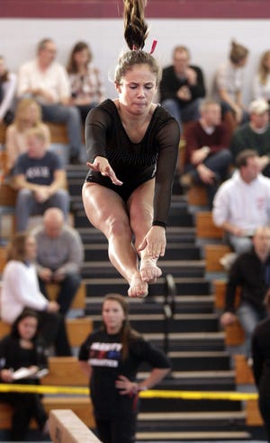 Medway-Holliston-Millis's Kat Govani on the balance beam during this past Saturday's MIAA South Sectional Girls Gymnastics Tournament at Hudson High. Wicked Local Staff Photo/ Marshall Wolff