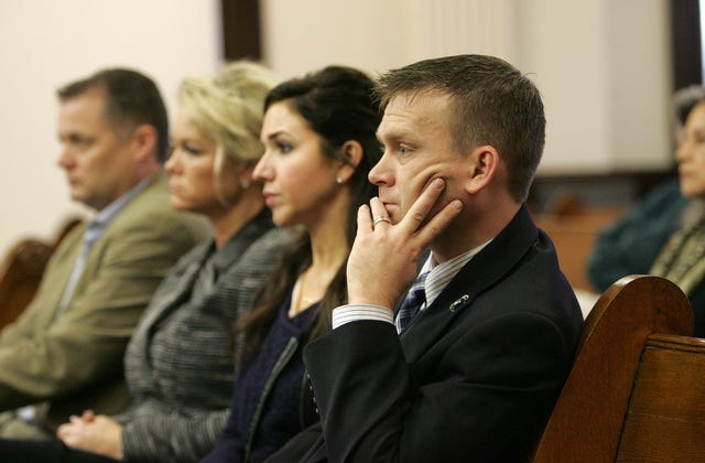 Several of Emily Fazzino's family members, including her brother Rick Beckwith, right, were in court for testimony Wednesday, Feb. 24, 2016, in Decorah, Iowa. Photo by Dennis Magee/Waterloo-Cedar Falls Courier 
 Prosecutor Daniel Kolacia, right, on Wednesday, Feb. 24, 2016, introduced as evidence the bath caddy found in Emily Fazzino's bathtub. Photo by Dennis Magee/Waterloo-Cedar Falls Courier 
 Capt. Kent Peterson with the Boone Fire Department testified Wednesday, Feb. 24, 2016, about participating in CPR with others on Emily Fazzino. Peterson indicated where and why he and others touched Fazzino's head and face. Photo by Dennis Magee/Waterloo-Cedar Falls Courier 
 Defense attorneys Trever Hook, left, and William Kutmus on Wednesday, Feb. 24, 2016, with members of Alexander Fazzino's family, including Nick Fazzino, right. Photo by Dennis Magee/Waterloo-Cedar Falls Courier 
 Boone police officer Korie Barber testified Wednesday, Feb. 24, 2016, about visting Alexander Fazzino's home on the night Emily Fazzino died. Photo by Dennis Magee/Waterloo-Cedar Falls Courier 
 Prosecutor Scott Brown and other attorneys confer with Judge Michael Moon on Wednesday, Feb. 24, 2016, in Winneshiek County District Court. Photo by Dennis Magee/Waterloo-Cedar Falls Courier 
 Defense attorney William Kutmus, left, confers Wednesday, Feb. 24, 2016, with prosecutor Scott Brown during a break in Alexander Fazzino's murder trial in Decorah, Iowa.