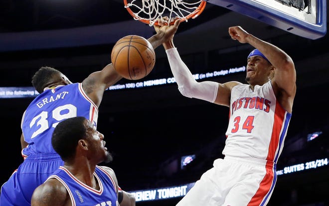 Detroit Pistons forward Tobias Harris (34) dunks as Philadelphia 76ers forward Jerami Grant (39) defends, during the first half of an NBA basketball game, Wednesday, Feb. 24, 2016, in Auburn Hills, Mich. (AP Photo/Carlos Osorio)
