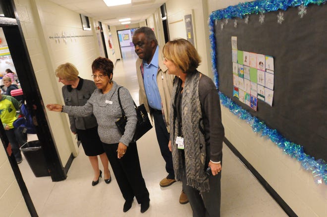 David and Minnie Kirkland tell Topsail Elementary School Principle Janet Redinger and Pender County Schools Superintendent Terri R. Cobb what some of the classrooms use to be like along Annadale's original hallway. The Kirkland's where at the school to talk to 5th grade students about what it was like to go to school there in the late 1950's. Both were a part of the first group of students to attend the all black Annandale School that has now grown into Topsail Elementary School. Their visit was part of the schools celebration of Black History month.