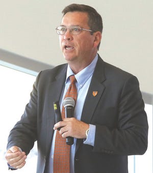 Michael Dorn, executive director of Safe Havens International, speaks Tuesday during the School Safety Summit at Kent State University at Tuscarawas' Performing Arts Center.