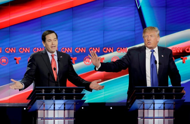 Republican presidential candidate, Sen. Marco Rubio, R-Fla., left, and Republican presidential candidate, businessman Donald Trump both speak during a Republican presidential primary debate at The University of Houston, Thursday, Feb. 25, 2016, in Houston.