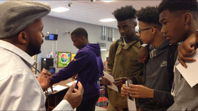 Donney Rose engages with students after his performance.
