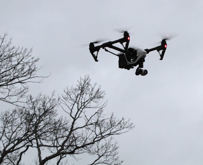 A drone is flown over Providence Thursday. Some drone enthusiasts have questioned whether states have the authority to limit drone use. The Providence Journal/Sandor Bodo