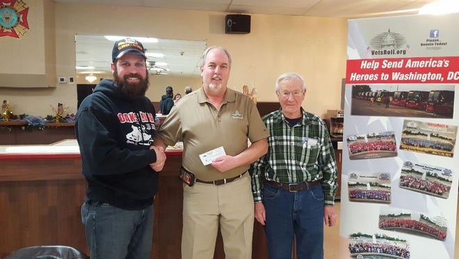 The Oaks Ridge Riders Snowmobile Club of Roscoe recently donated $1,200 to Vets Roll. Pictured, from left: Kai Steward, Oaks Ridge Riders president, Mark Finnegan of Vets Roll and John Rossato, commander of the Roscoe Veterans of Foreign Wars and 2015 Vets Roll participant. PHOTO PROVIDED