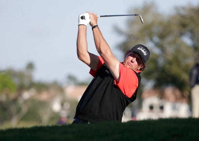 Phil Mickelson hits from a sand trap on the 12th fairway during the first round of the Honda Classic on Thursday in Palm Beach Gardens. (AP Photo/Lynne Sladky)