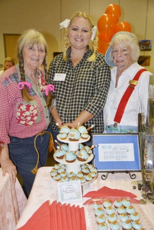 The Friends Guild of the Destin Library hosted a successful Valentine's Day event Friday afternoon at the library. The Cupcake Challenge featured six local bakers competing for best taste from the crowd of about 60 people. After tasting the delectable treats, three barbershop quartets from Emerald Coast Chorus performed love songs and do-wops for the visitors. Jean Webber, Dawn Charbonneau and Jane Chadderdon of the Walton County Snowbirds Club went with the theme of Huckleberry Finn with their cupcake offering. The Walton Snowbirds took first for booth display and for creativity.