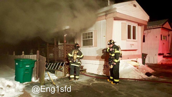 Firefighters extinguish a two-alarm fire on Hawkes Street. Courtesy photo / damian drella