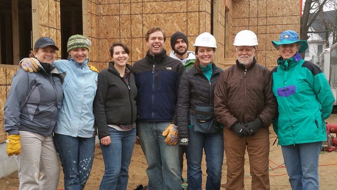 On a rainy day in December, we closed the McHenry Architecture office and volunteered with Habitat for Humanity in Rochester. Courtesy photo