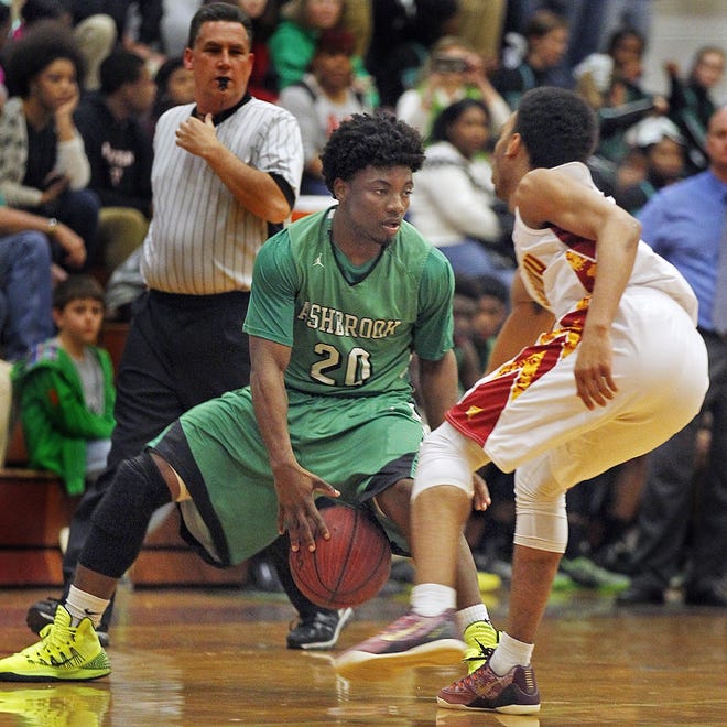 Ashbrook's Jeff Glenn (20) handles the ball against Hickory's Caron Corpening (right) during Ashbrook's 48-44 victory at Hickory in the 2015 third round. Glenn and Ashbrook will hope to knock off the Red Tornadoes on the road for the second straight year Saturday in the 3A third round. Ernie Masche/Hickory Daily Record