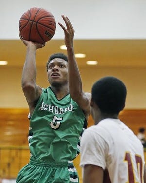 Ashbrook's Malik Gingles (5) shoots jumper in Green Wave's 66-45 loss to Hickory.