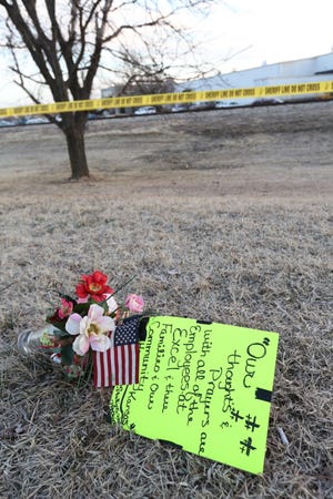 A memorial supporting the victims from Thursday’s shooting lays on the ground near the Excel Industries plant in Hesston, Friday morning, Feb. 26, 2016.