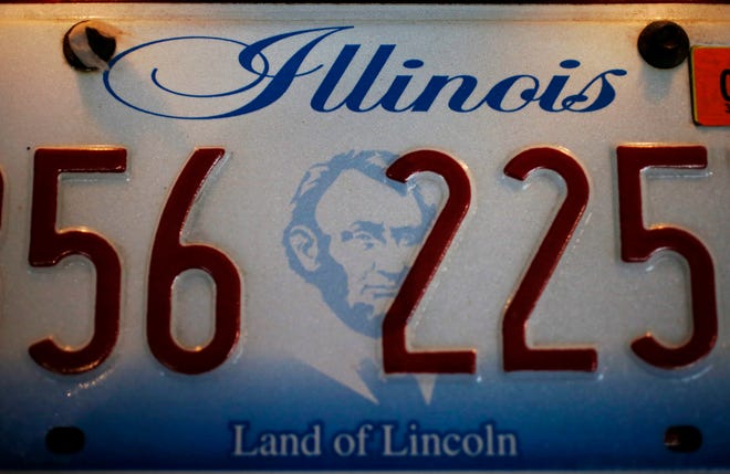 This Thursday, Dec. 27, 2012, photo taken in Chicago shows an Illinois license plate. (AP Photo/Charles Rex Arbogast)