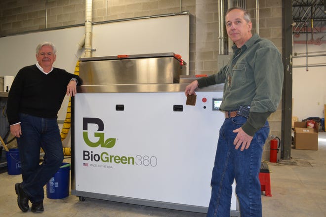 Craig Divino, left, is vice president and CFO, and Paul Grillo, right, is president and CEO of BioGreen360. The Portsmouth company makes and distributes a machine designed to process food waste, keeping the waste out of landfills by creating a fertilizer product. Paul Briand photo