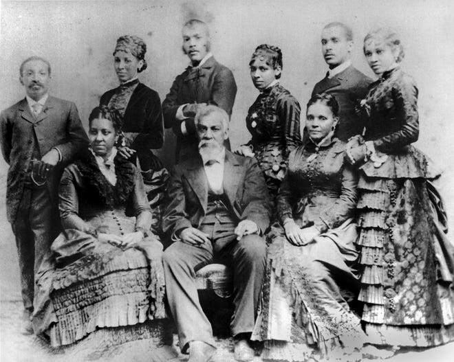 George Downing, a prominent Newport African-American businessman, and his family. DOWNING GROUP