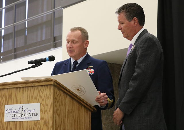 Keynote speaker, Fifth Coast Guard District, Rear Adm. Stephen P. Metruck and County Commission Chair Robin Comer speak to attendees during the Carteret County and Carteret County Chamber of Commerce Coast Guard Community Ceremony in Morehead City Thursday.